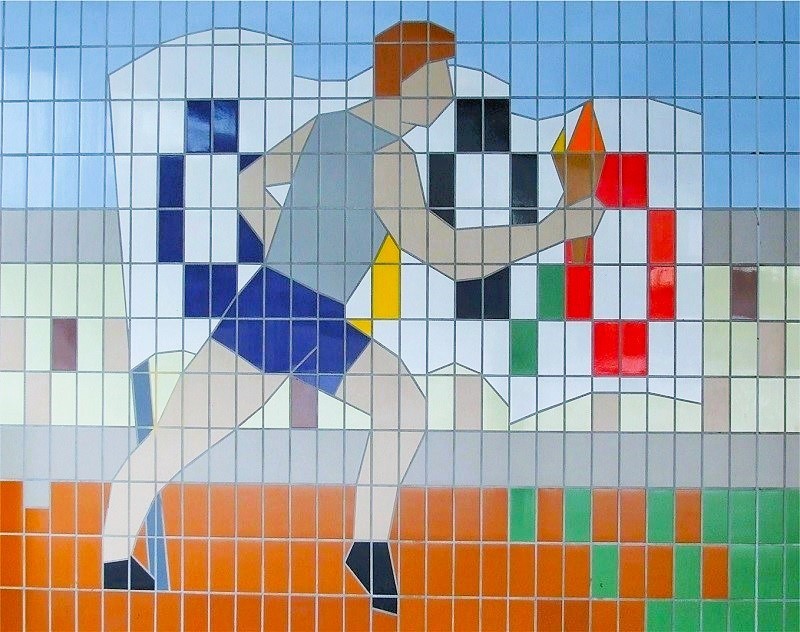 Olympic Torch Mural, Commemorating 1948 Games At Wembley. The Olympic Torch mural has been hidden from public view for more than a decade. Image Credit: Philip Grant. Permission to use with all LDRS partners.