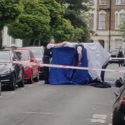 Police at Loveridge Road, Kilburn, after a stabbing