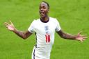 England's Raheem Sterling celebrates scoring the first goal in the 2-0 win against Germany.