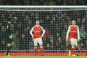 The anguish shows on the faces of Arsenal players (l-r) Petr Cech, Laurent Koscielny and Nacho Monreal after they concede the opening goal against Watford
