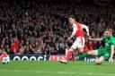 Mesut Ozil scores his secocnd goal - and Arsenal's fourth - in their Champions League win over Ludogorets