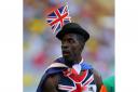 Great Britain's Dwain Chambers stands dejected after the Men's 4x100 metres relay