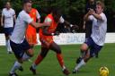 Tahjae Anderson forces his way past Yate Town defenders (pic DBeechPhotography)