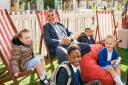 Brent Council leader Muhammed Butt relaxes with children at a promotion for school streets