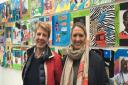 Sarah Reynolds and Hilary Brigden of Salusbury World infront of a Stonebridge Primary school project currently at Willesden Library. Picture: Nathalie Raffray