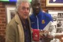 Eddie Oshodi picks up the man of the match award  from Wealdstone chairman Peter Marsden (pic Nick DuGard}