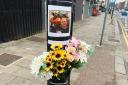 Flowers after a motorcyclist died in a crash in January 2024