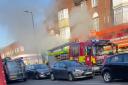 A cordon is in place in Bridge Road as firefighters tackle the blaze
