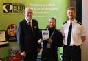 (L-R) National Pubwatch chair Steve Baker OBE, JJ Moons barman Jean-Luc Julienne, and South Yorkshire Police Chief Superintendent Ian Proffitt