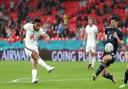 England's Reece James (left) has a shot at goal during the UEFA Euro 2020 Group D match at Wembley Stadium, London. Picture date: Friday June 18, 2021.