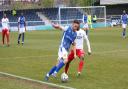 Wealdstone striker Danny Parish holds off Dagenham & Redbridge's Mauro Vilhete