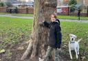 Alfie Brass, 10, is asking people to think of the planet this Christmas. Pictured with family dog Lulu