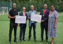(L-R) Otis Roberts, Cllr Parvez Ahmed, John James receive cheques from former mayor Cllr Ernest Ezeajughi, and wife Ijeoma Ezeajughi