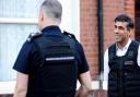 Rishi Sunak watching immigration officers in Brent