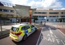 Police outside Central Middlesex Hospital after reports two people had been stabbed