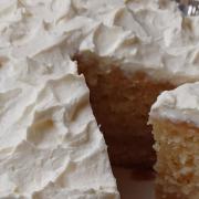 A Tres Leches cake is made with condensed and evaporated milks with whipped cream frosting