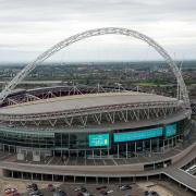 Three men were charged following a stabbing outside Wembley Stadium last month