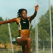 Connie Henry in long jump action