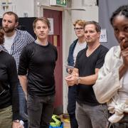Samuel Townsend (centre) and Bridgette Amofah (Right) are starring in A Christmas Carol at the Old Vic