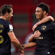 Milton Keynes Dons’ Jay Bird (right) celebrates scoring his side's second goal of the game during the EFL Trophy match at the Lamex Stadium, Stevenage.