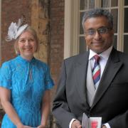 Dr Ganesh Suntharalingam, and wife Kim, with the OBE.