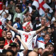 England fans celebrate the Three Lions win over Germany after the UEFA Euro 2020 round of 16 match at Wembley Stadium.