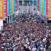 Fans leave Wembley stadium following England's triumphant win against Germany