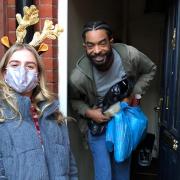 A Sufra Foodbank & Kitchen NW London volunteer delivering a food parcel