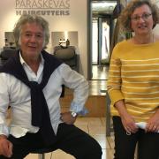 Johnny Paraskevas, owner of Paraksevas Haircutters in Park Parade with customer Alison Lee. Picture: Nathalie Raffray