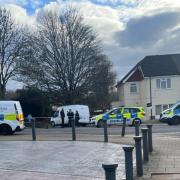 Police were captured outside Dors Close, investigating reports of shots fired
