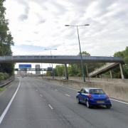 Police closed a section of the M1 after the brother of a man about to be returned to Albania threatened “self-harm” on a motorway bridge on the M1 at Staples Corner