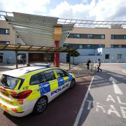 Police outside Central Middlesex Hospital after reports two people had been stabbed