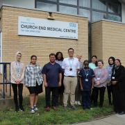 Dr Nam Hunger-Nguyen with his team at Church End Medical Centre
