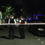 Police at the scene of an alleged murder in Casselden Road, Harlesden