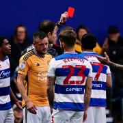 QPR's Andre Dozzell is shown a red card during their game against Leicester City
