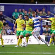 QPR's Sam Field battles for the ball with Norwich's Adam Idah