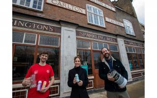 Landlords Ben Martin (left) and Tom Rees with local resident Polly Amos Robertson in front of the soon to be opened Carlton Tavern