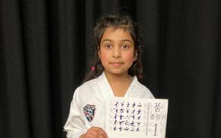 Matilde Ombigah Luis is thought to be one of the youngest to achieve taekwondo black belt grade in  the UK