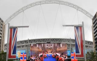 Big screen at Wembley Stadium showing coronation live