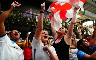 England fans celebrate following a screening of the FIFA Women's World Cup 2023 semi-final at Boxpark Wembley